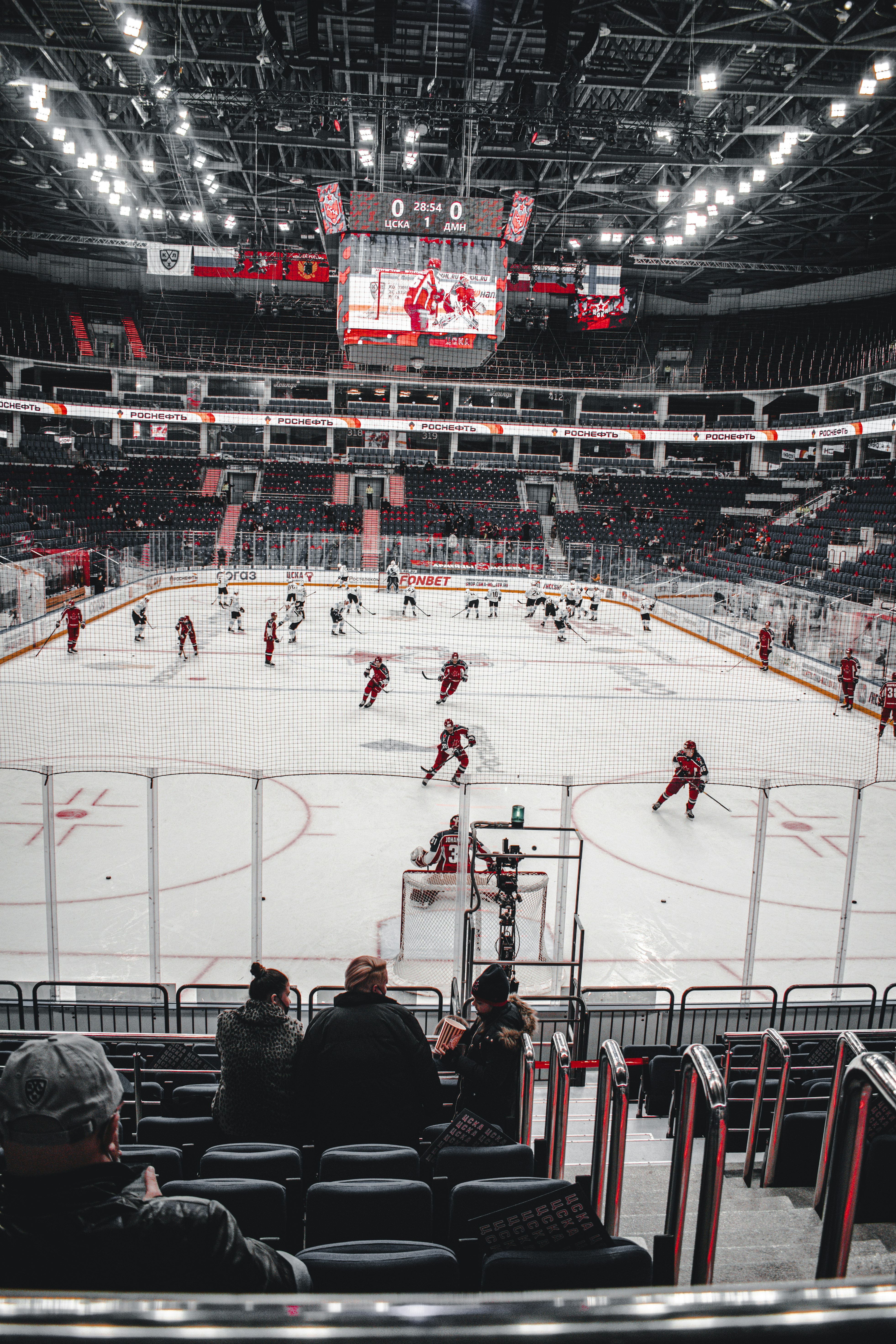 people playing ice hockey on stadium