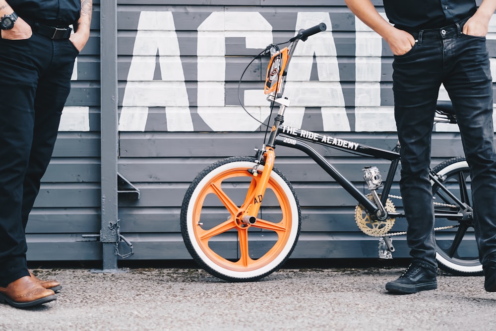 person riding on black and yellow bicycle