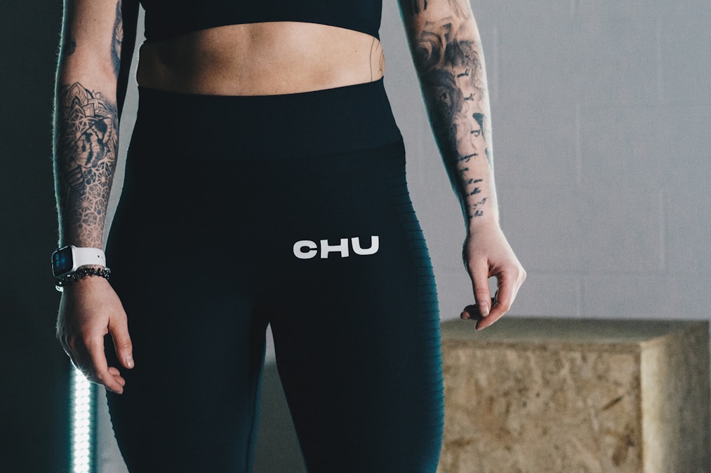 Close-up of a wide high-rise waistband on dark blue leggings