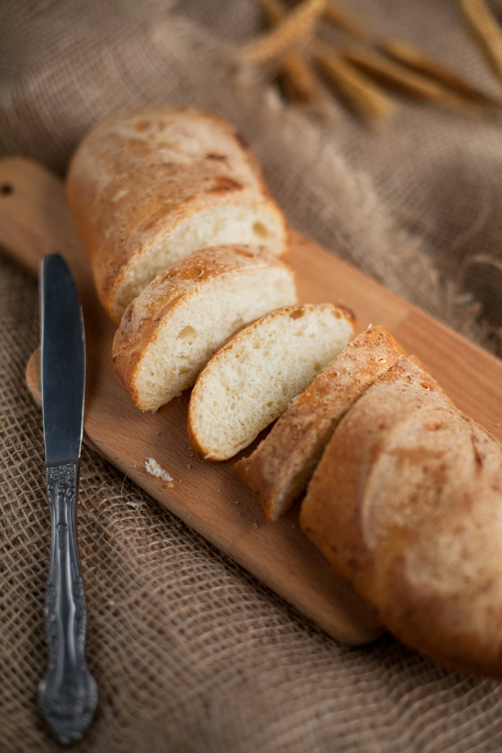 sliced bread on brown wooden chopping board