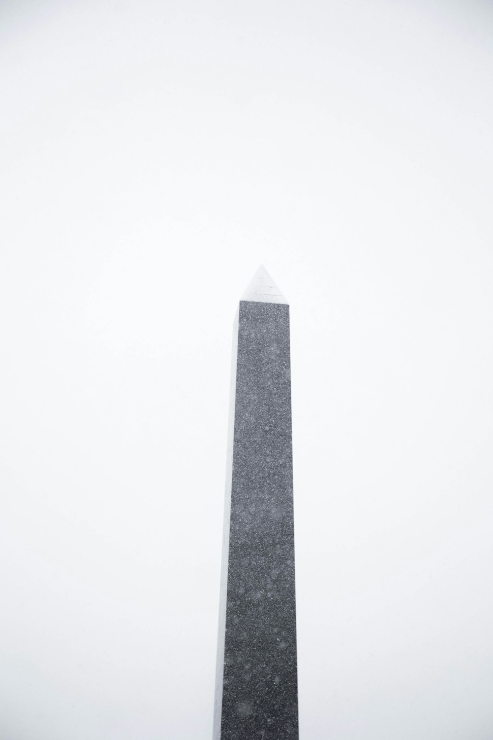 gray concrete tower under white sky