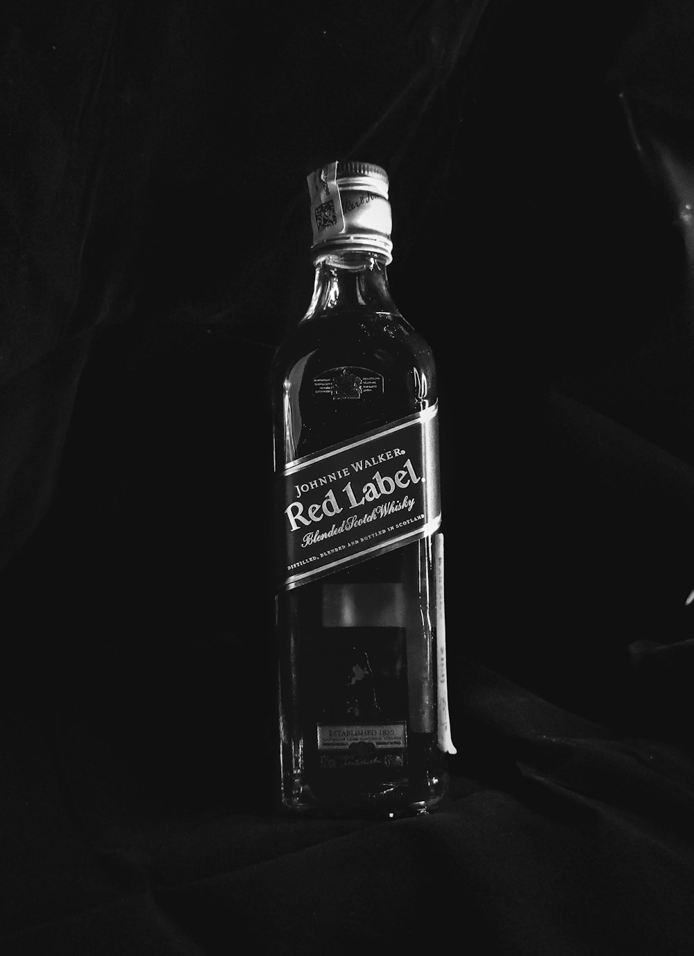 grayscale photo of jack daniels whiskey bottle