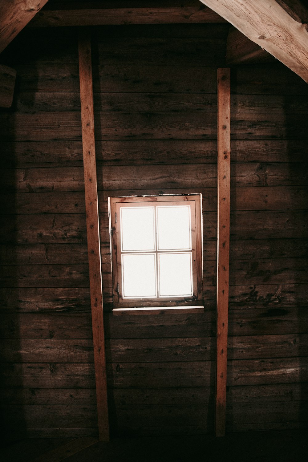 brown wooden framed glass window