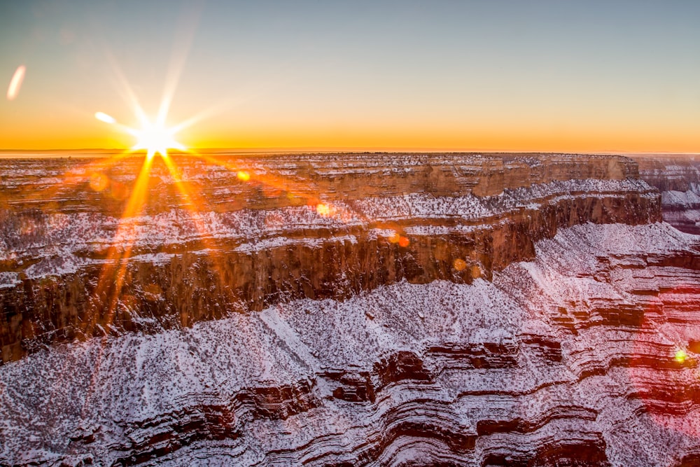 brown rocky mountain during sunset