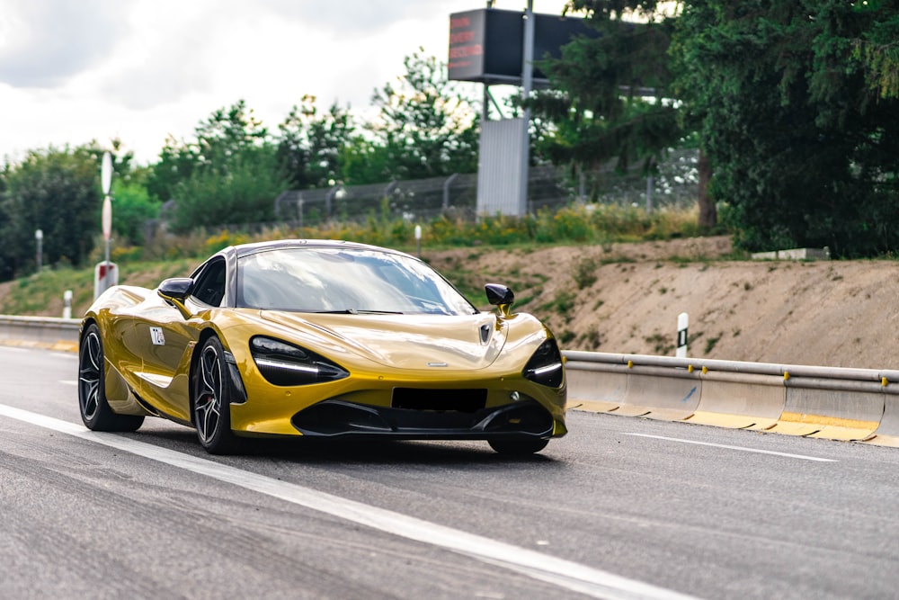 yellow lamborghini aventador on road during daytime