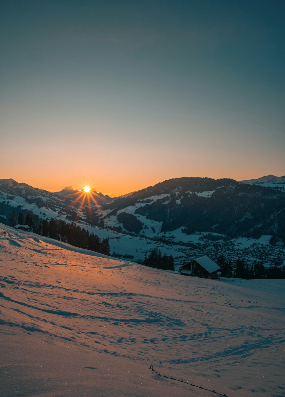 snow covered mountain during sunrise