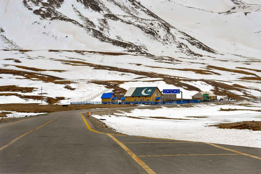 blue and white house near mountain during daytime