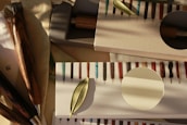An artisan carefully assembling a pen in a well-lit workshop.