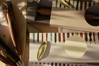 Close-up of colorful promotional pens arranged neatly on a wooden desk