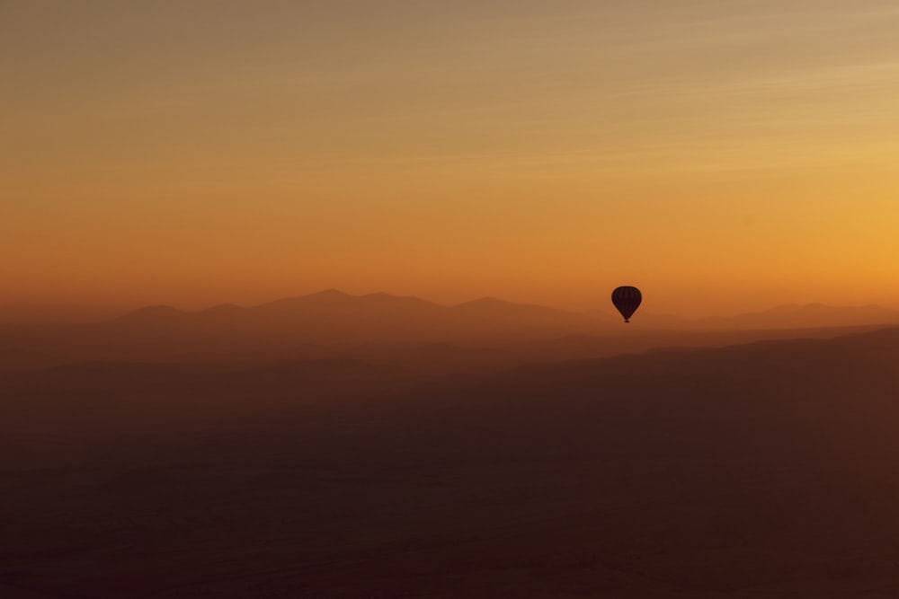 hot air balloon in the sky during sunset