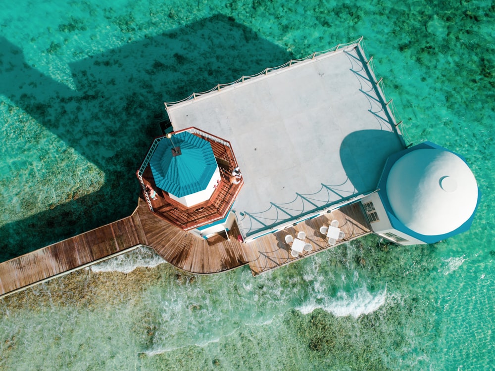 aerial view of brown and white building on body of water during daytime