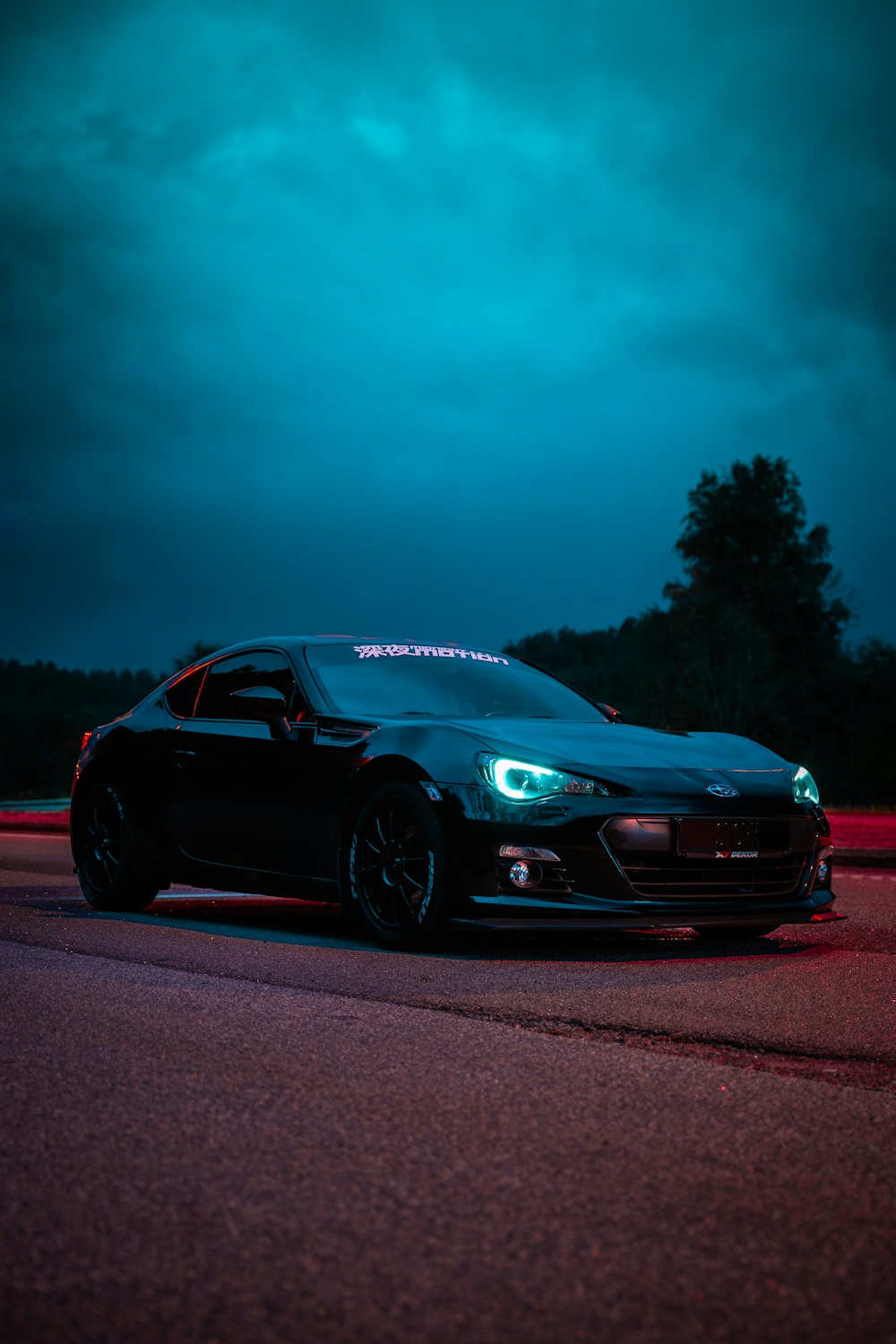 black chevrolet camaro on road during night time