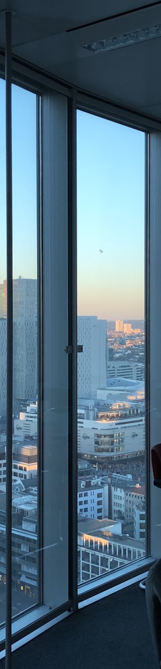 people sitting on chair near glass window during daytime