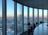 people sitting on chair near glass window during daytime