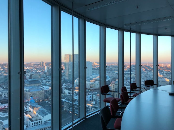 people sitting on chair near glass window during daytime