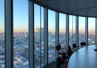 people sitting on chair near glass window during daytime