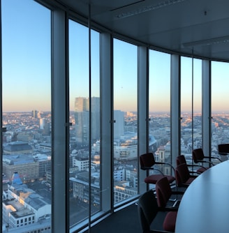 people sitting on chair near glass window during daytime