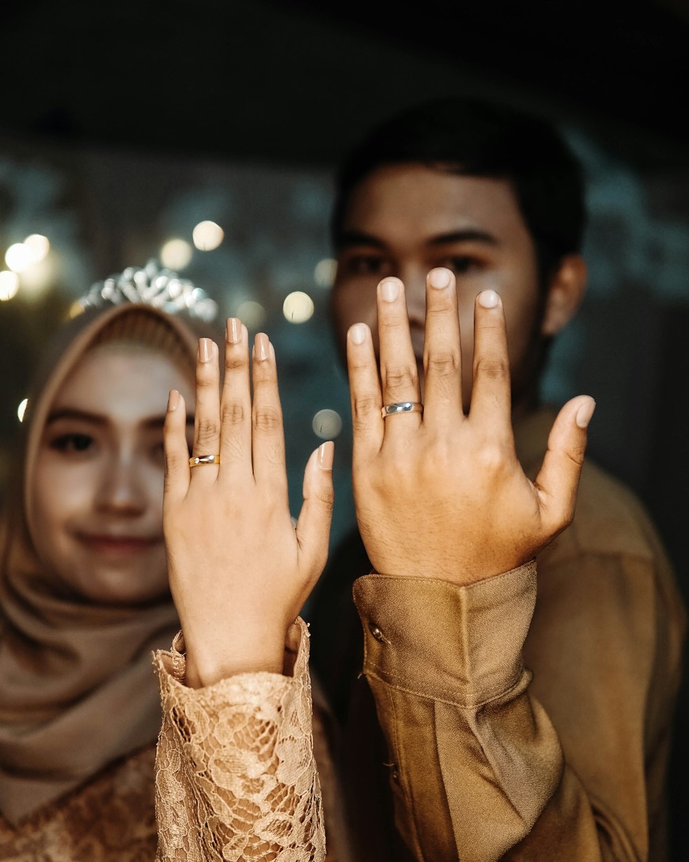 woman in brown long sleeve shirt with silver ring