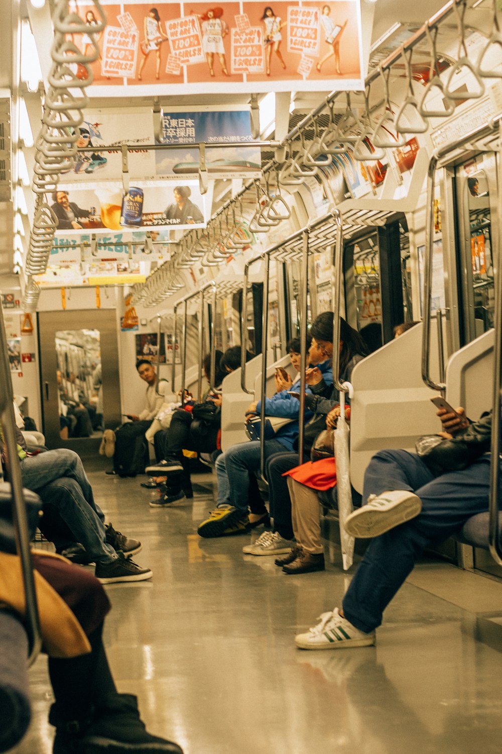 people sitting on chair inside train