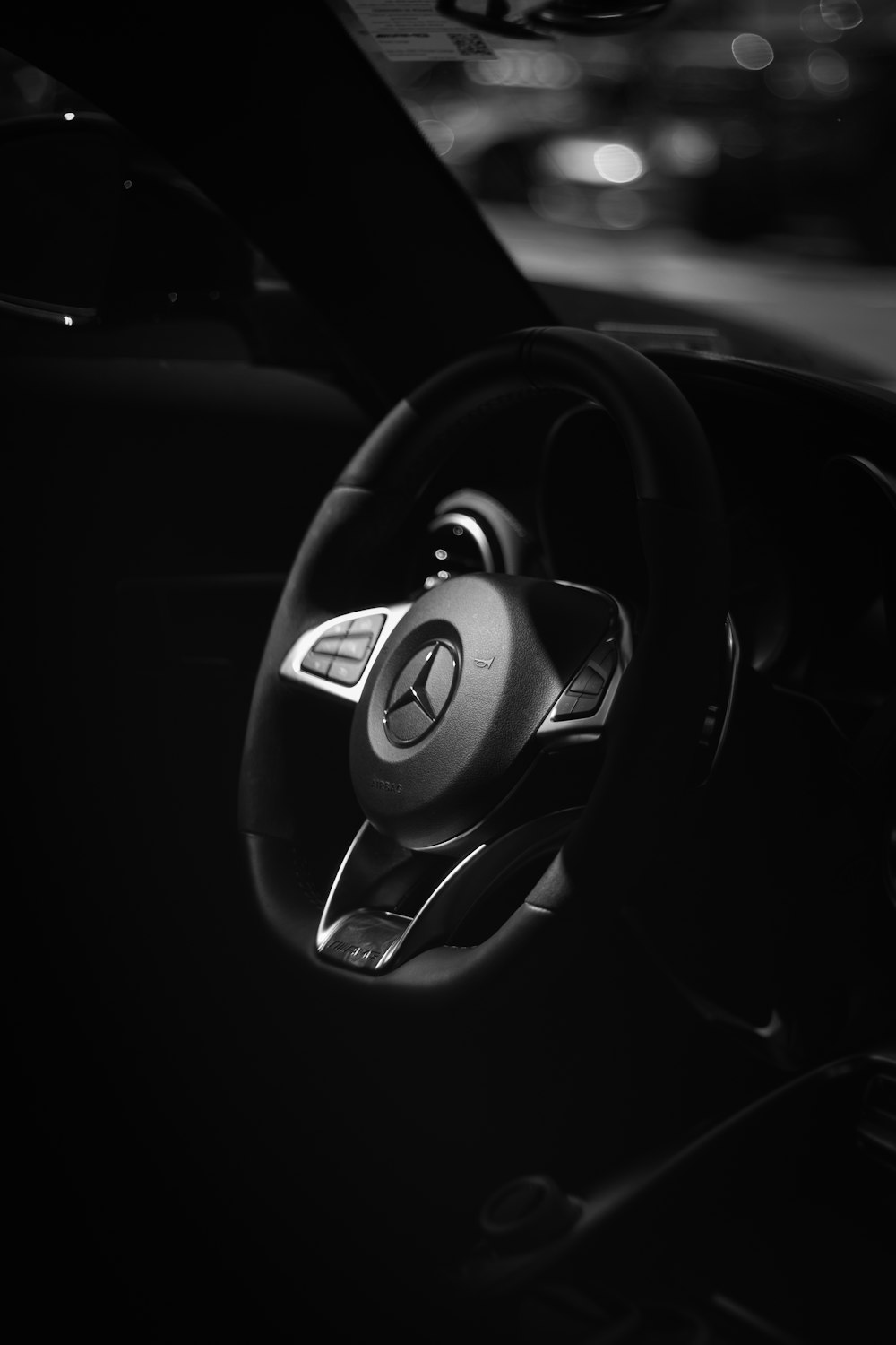 black and white bmw steering wheel