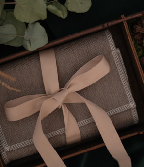 brown and black book on green leaves