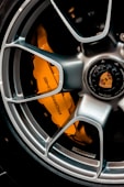 grey and orange multi spoke car wheel