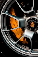 grey and orange multi spoke car wheel