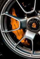 grey and orange multi spoke car wheel