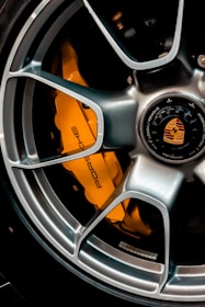 grey and orange multi spoke car wheel