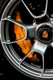 grey and orange multi spoke car wheel