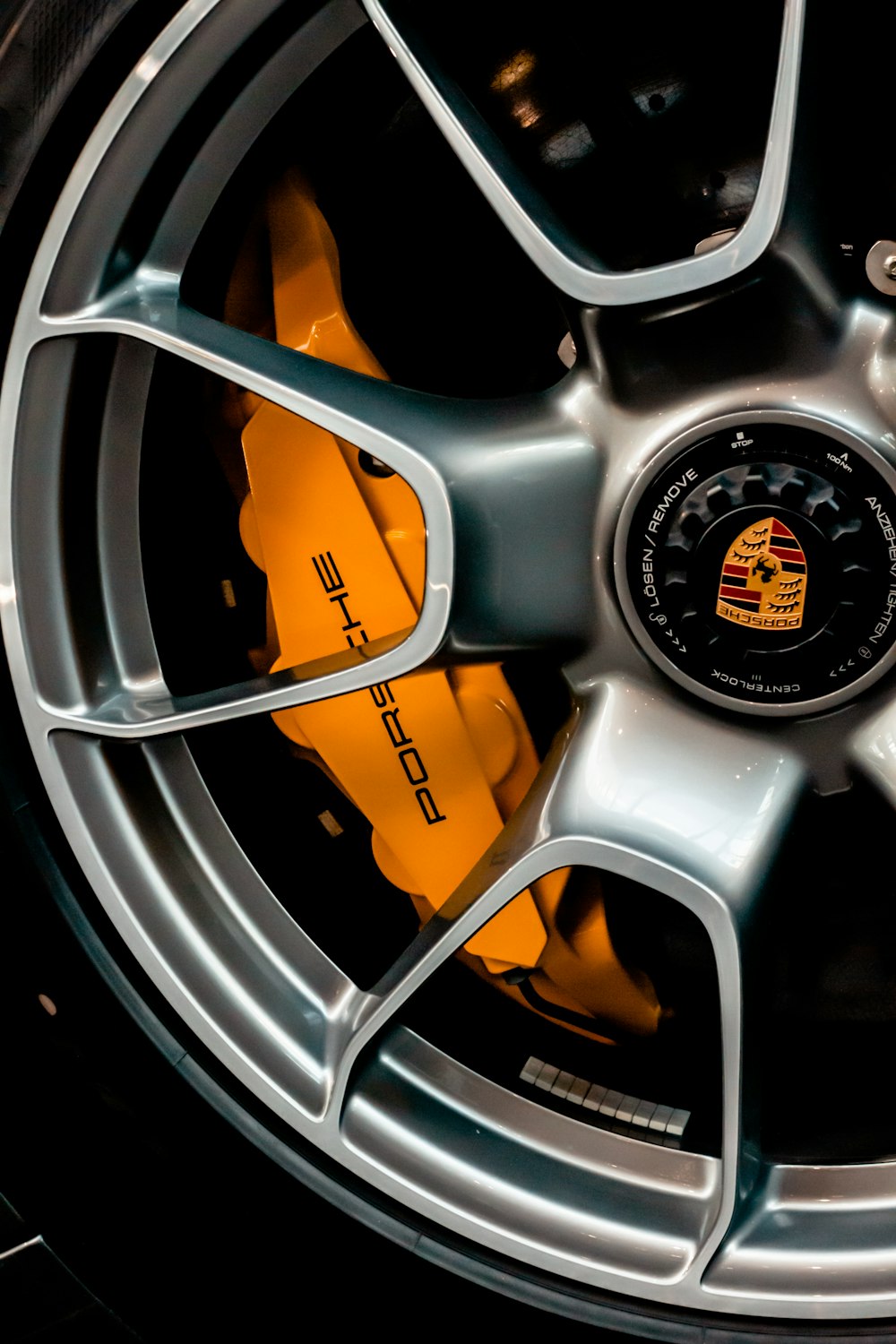 grey and orange multi spoke car wheel