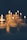 A collection of elegant candles displayed in a warm, inviting atmosphere.