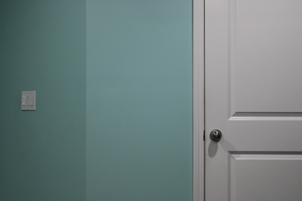 white wooden door with silver door lever