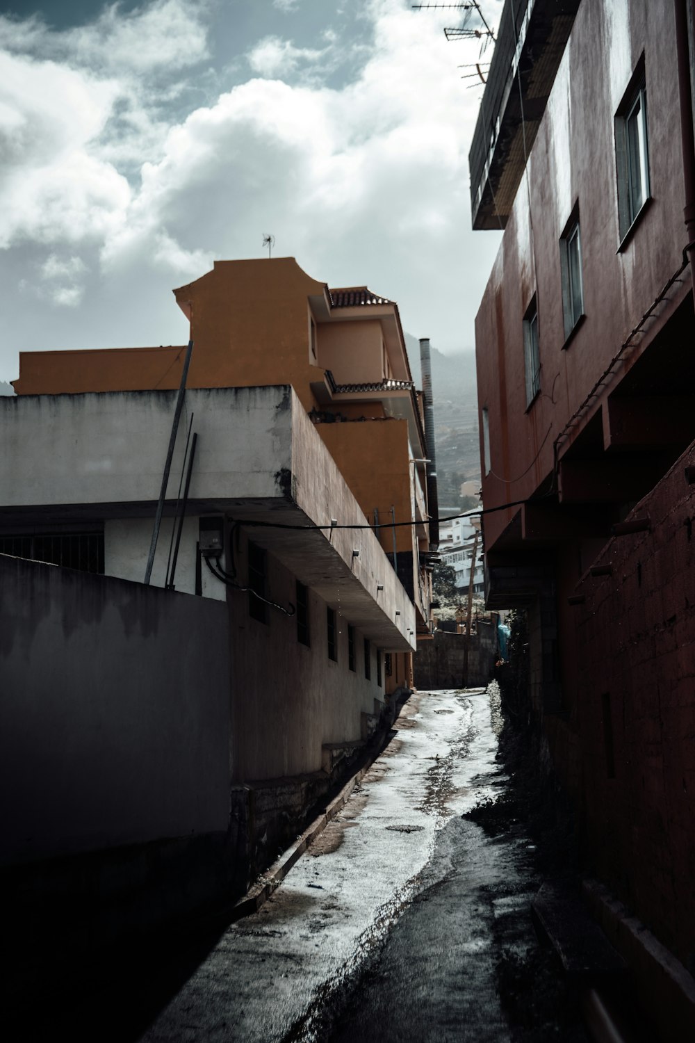 brown concrete building beside river during daytime