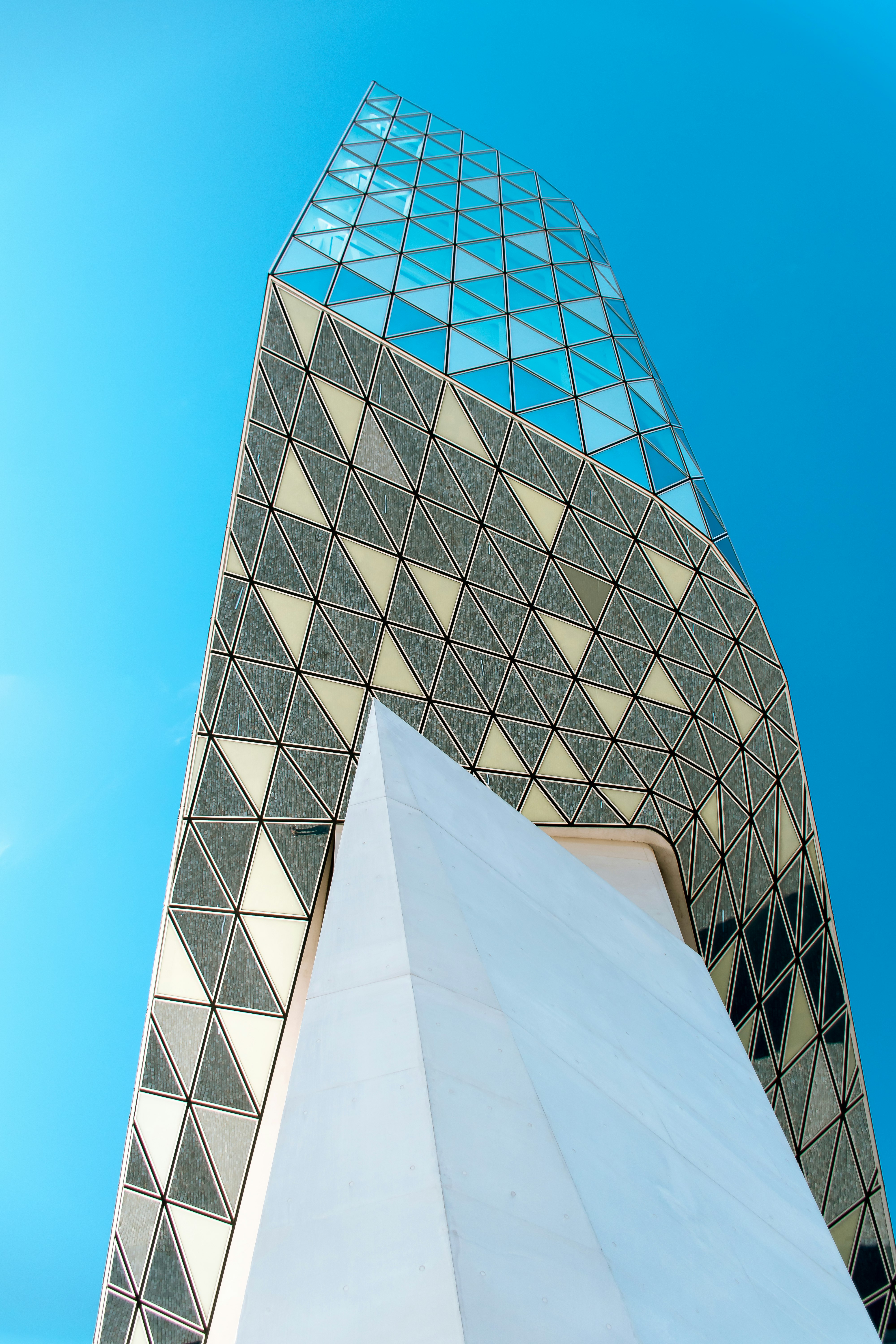 white and blue concrete building under blue sky during daytime