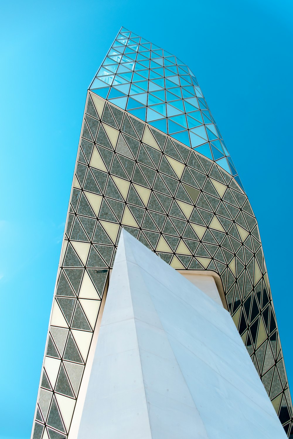 white and blue concrete building under blue sky during daytime