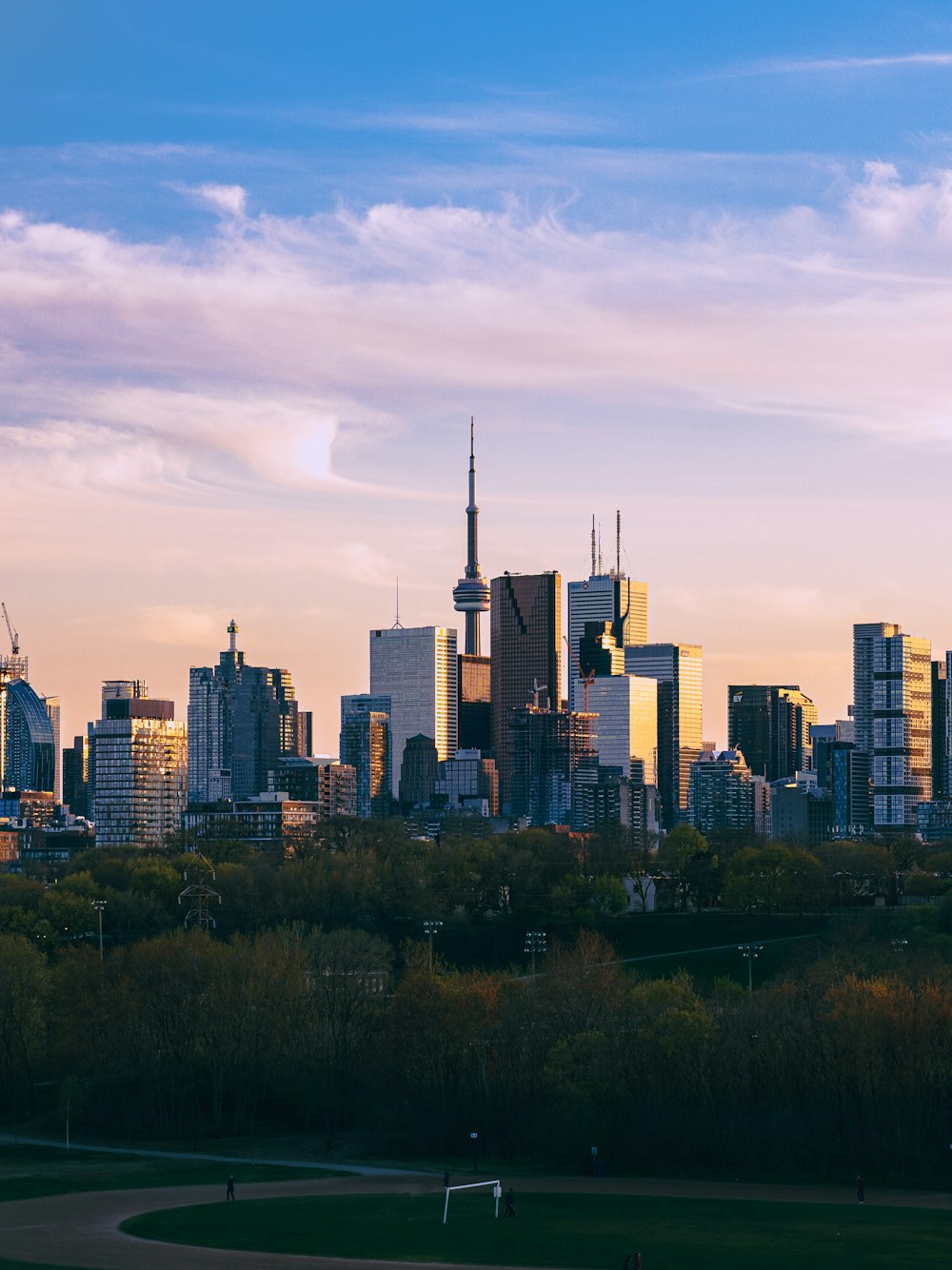 city skyline under white clouds during daytime