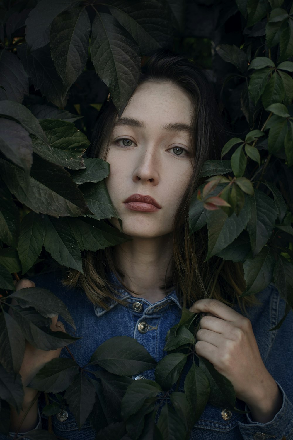 woman in blue denim button up jacket