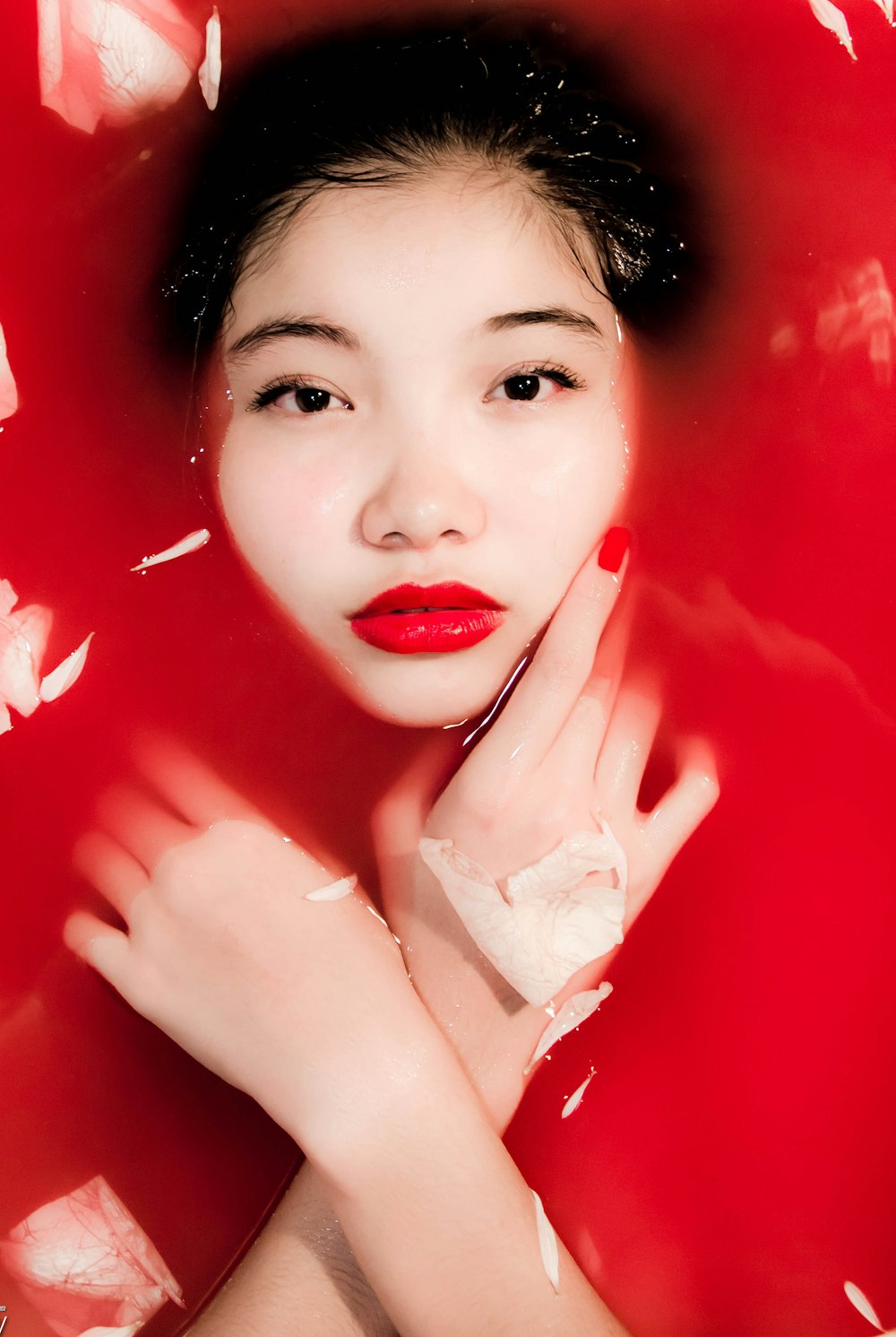 woman in red lipstick and white shirt