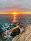 body of water during sunset
