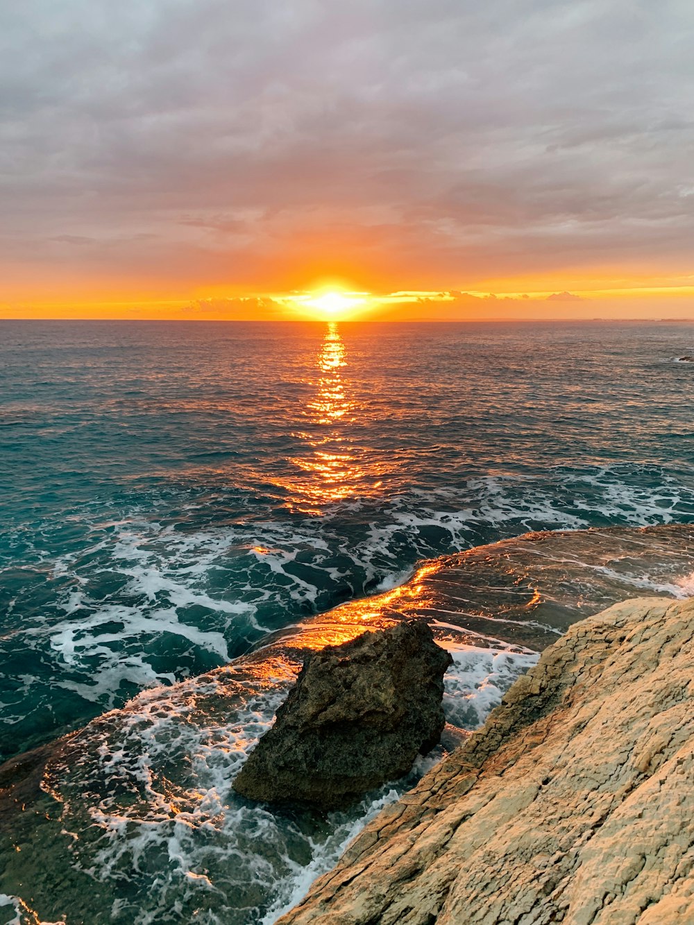 body of water during sunset