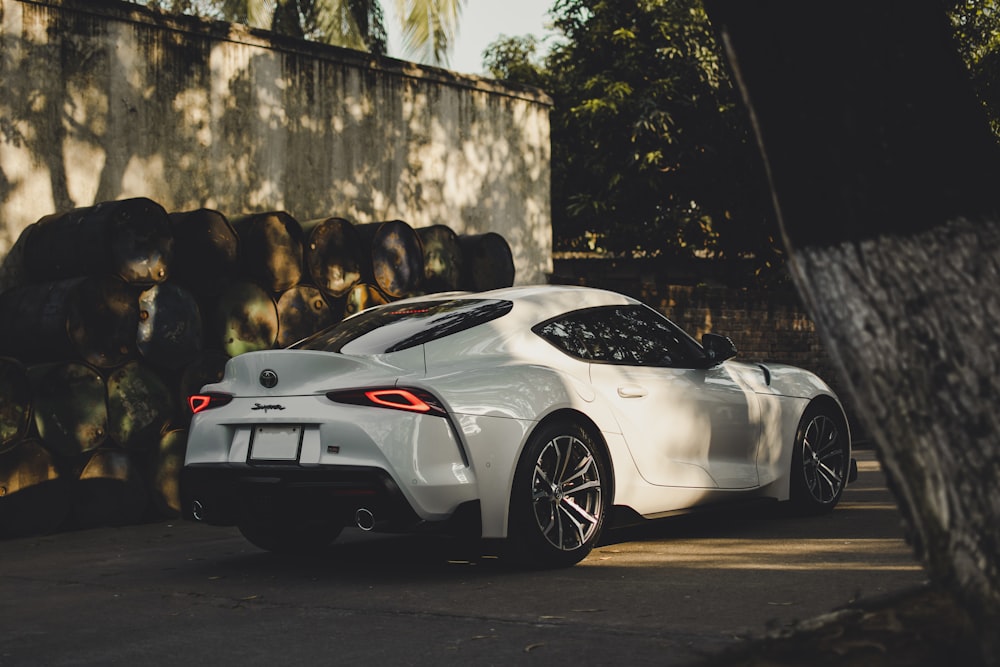 white porsche 911 parked on road during daytime