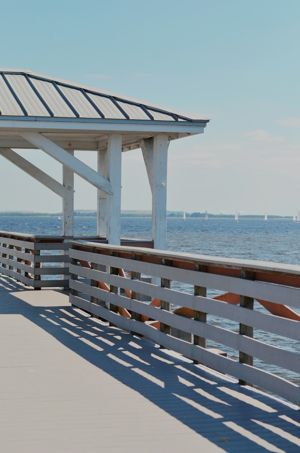 brown wooden dock on sea during daytime