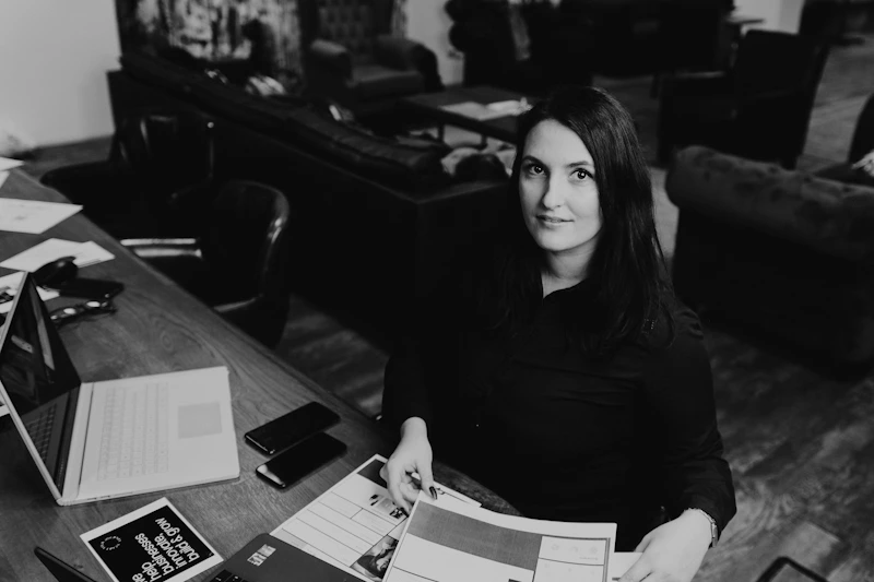 thoughtful single woman seated in a modern space