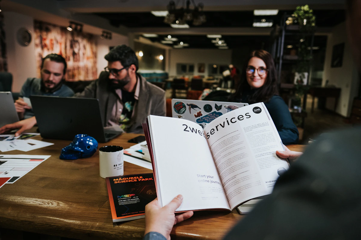 Three women collaborating on laptops in a co-working space