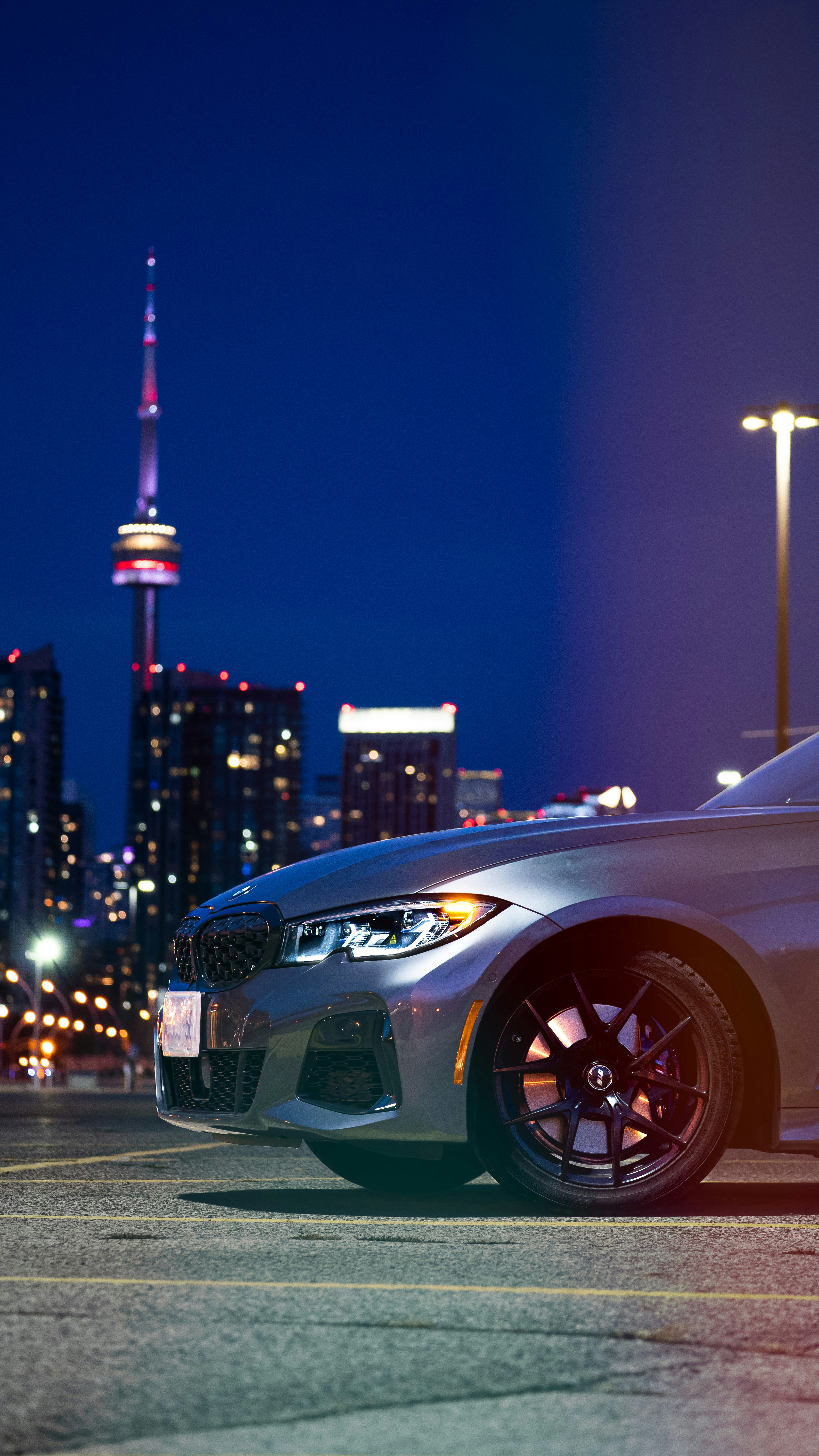 white bmw m 3 coupe on road during night time