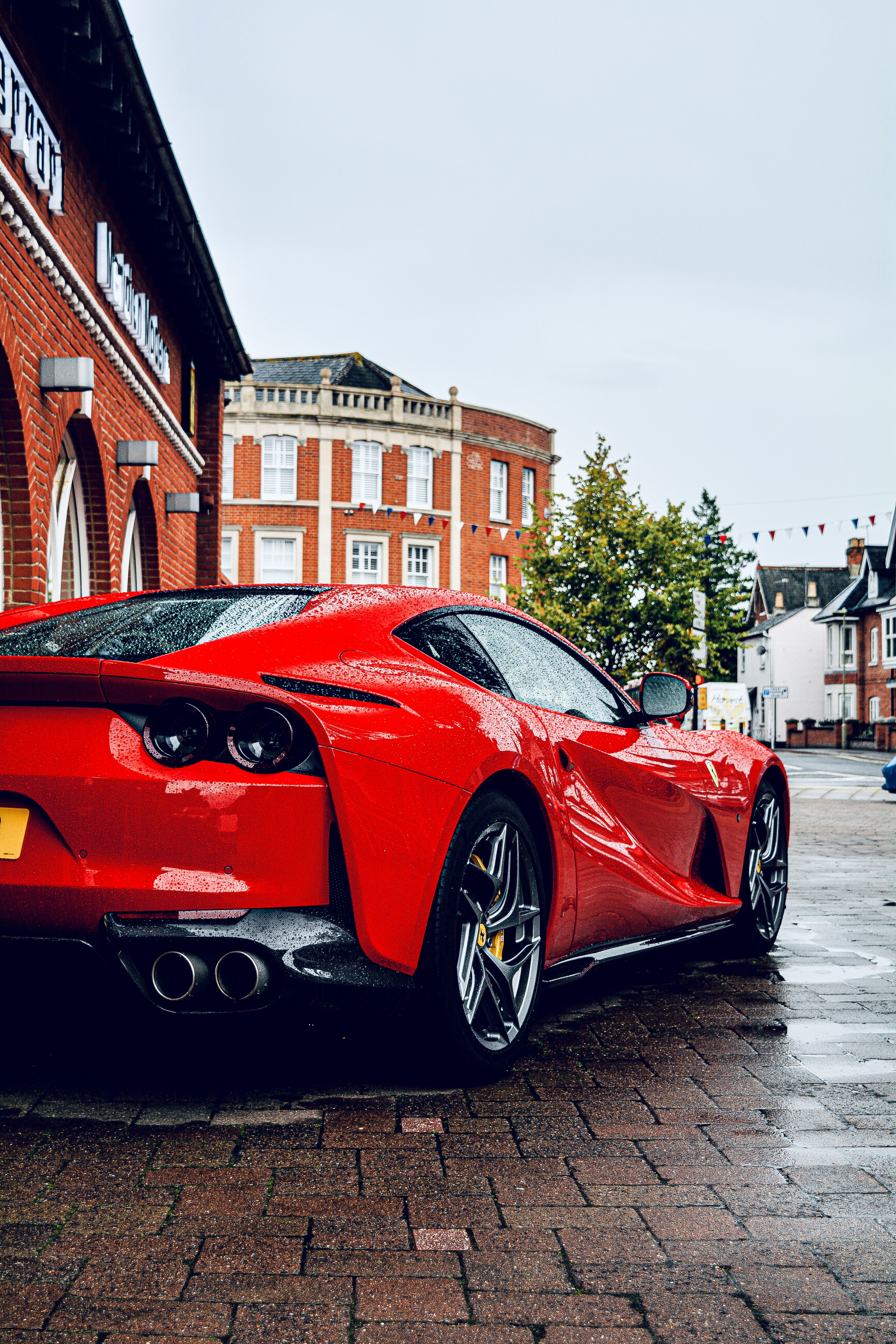 red ferrari 458 italia parked on street during daytime