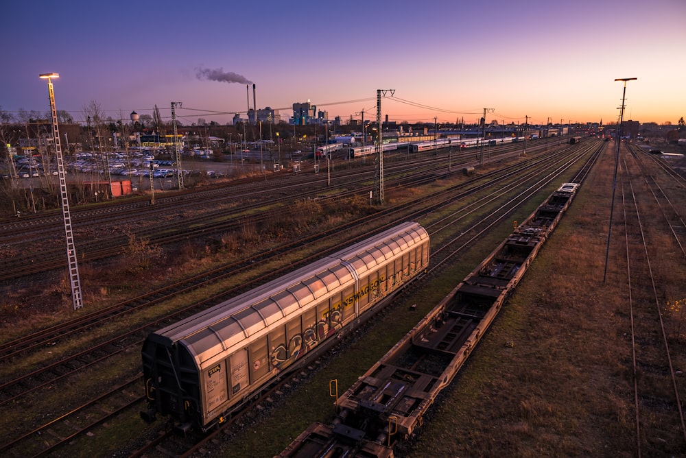 train rail under blue sky during daytime