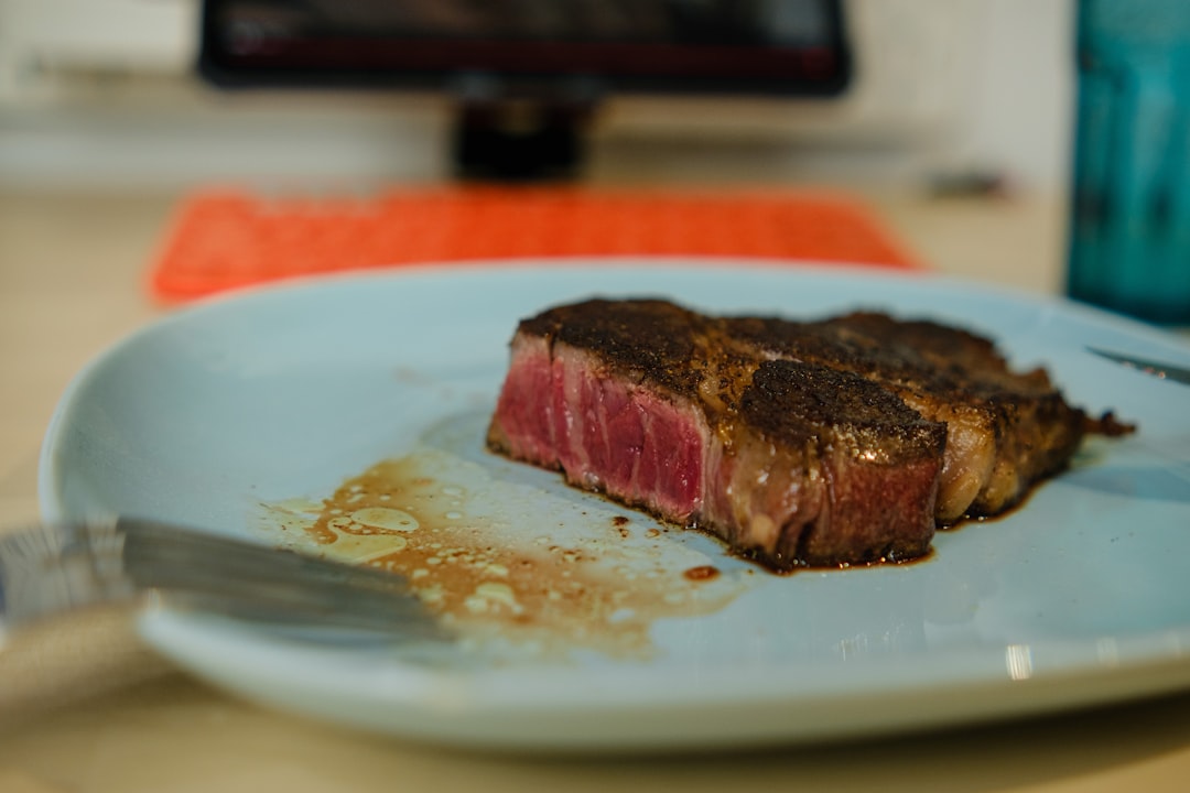 sliced meat on white ceramic plate