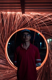 man in red polo shirt wearing black sunglasses